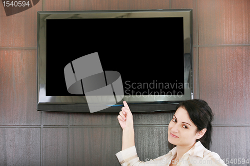 Image of businesswoman presentation with lcd tv 