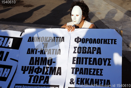 Image of Protester in White Mask
