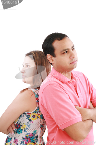 Image of Young couple standing back to back having relationship difficult