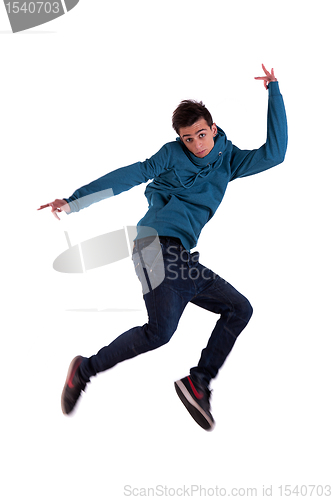 Image of Portrait of a very happy young man, jumping with his arms  open