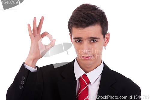 Image of Portrait of a  happy young man, with thumbs raised as a sign of ok