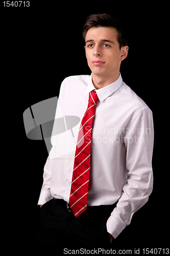 Image of Portrait of a young business man isolated on black background