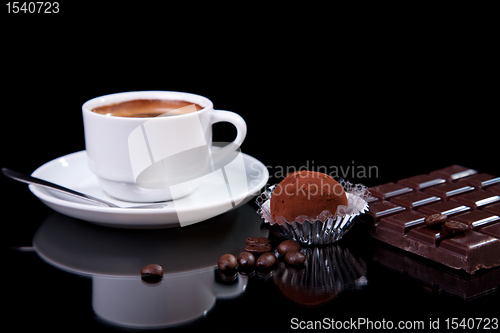 Image of Coffee with chocolate - brigadier, on black with reflexion