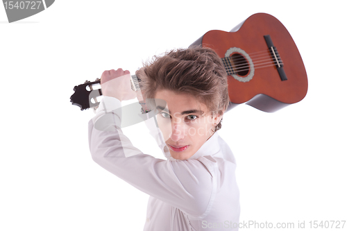 Image of Handsome and angry young man musician guitar player portrait on white