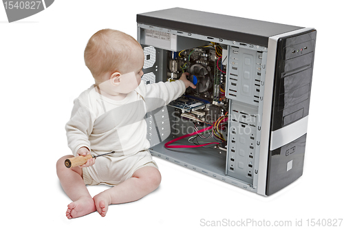 Image of young child working on open computer