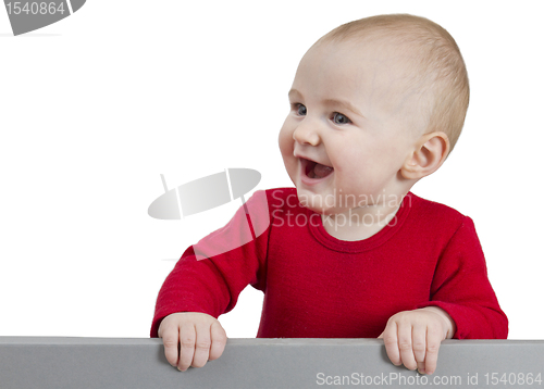 Image of young child holding sign