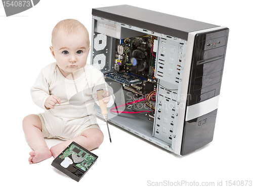 Image of young child working on open computer