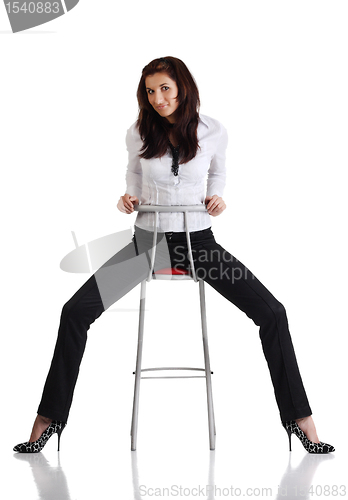Image of Girl sitting on the bar chair