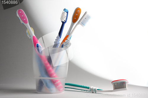 Image of Toothbrushes in a glass