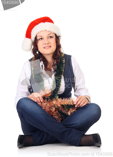 Image of Girl in a santa hat with christmas decoration