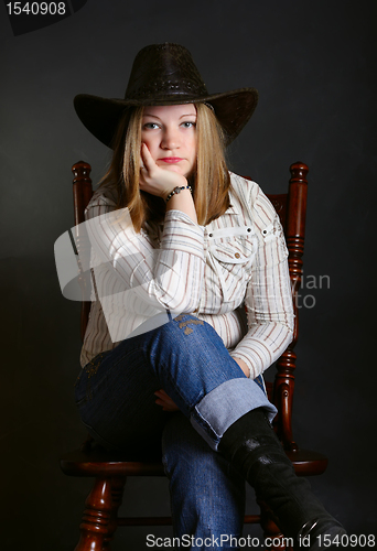 Image of Girl sitting on a chair