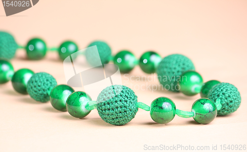 Image of Green necklace at pink background