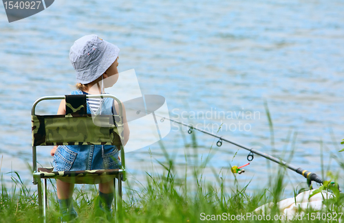 Image of Little boy with fishing rod