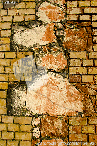 Image of Interesting architecture wall of bricks cross sign 