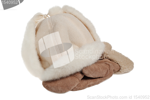 Image of women's winter fur hat and mittens, isolated on white 
