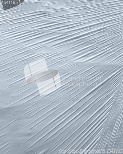 Image of wrapped white plastic foil detail