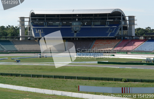 Image of race course and tribune at summer time
