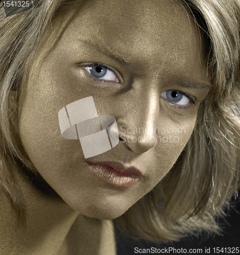 Image of golden face of a young woman