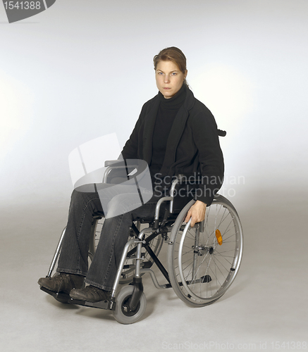Image of woman sitting in a wheelchair