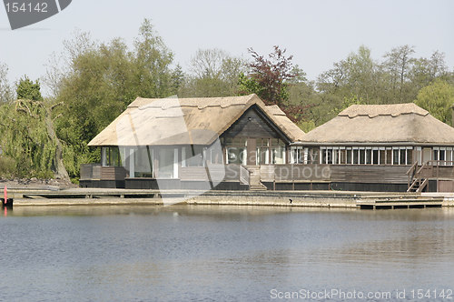 Image of wooden thatched cottages