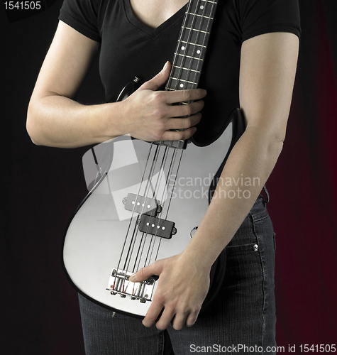 Image of woman with bass guitar