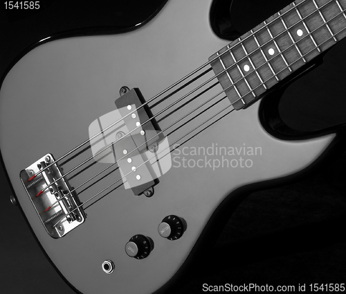 Image of black bass guitar detail