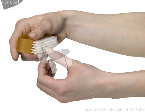 Image of cleaning nails with a scrubber