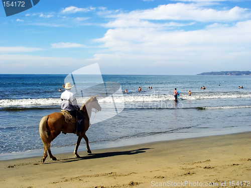 Image of Lone rider on the beach