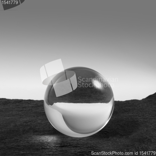 Image of crystal ball on stone surface