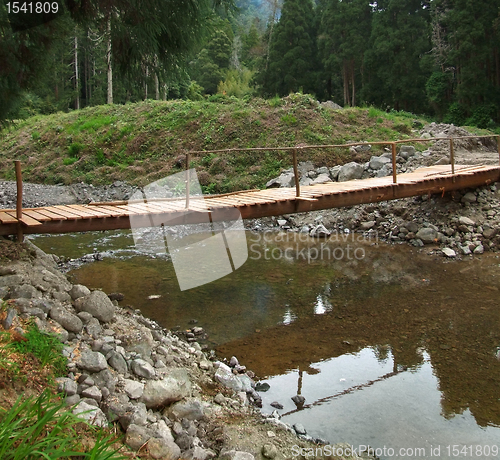 Image of wooden bridge and stream