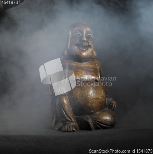 Image of Buddha sculpture in dark back