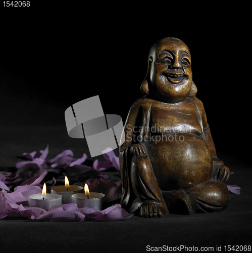 Image of Buddha sculpture in dark back