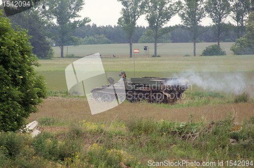 Image of offroad scenery with driving tank