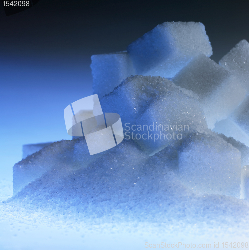 Image of blue illuminated lump sugar pile