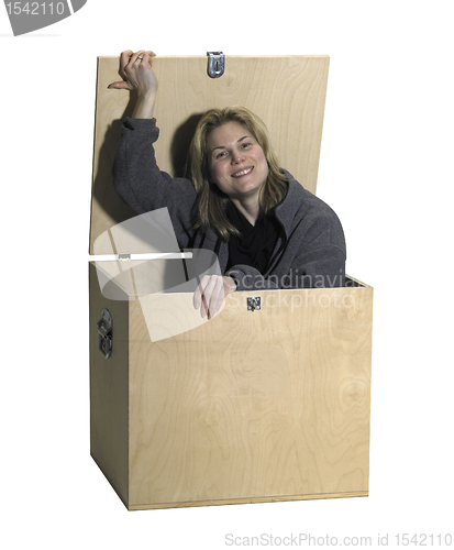 Image of girl sitting in a wooden box