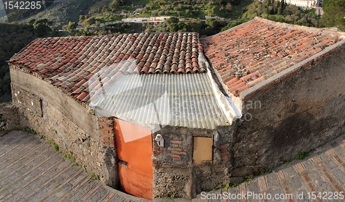 Image of Old poor house under the  tile roof