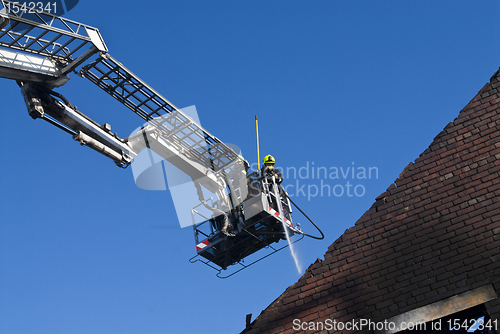 Image of Firemen in aerial platform