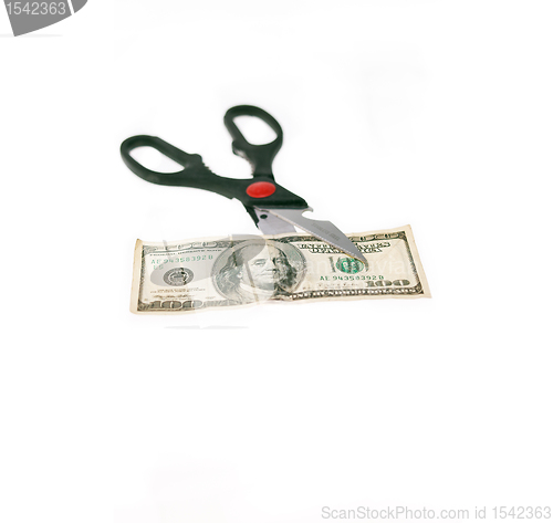 Image of scissors cutting US dollar bill  isolated on white