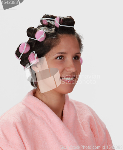 Image of Woman with hair curlers