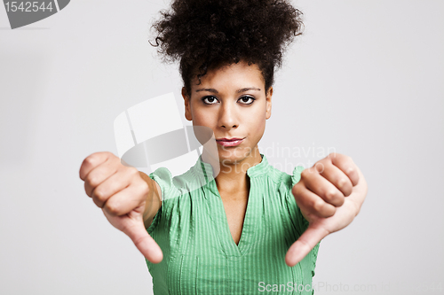 Image of Beautiful woman with thumbs down