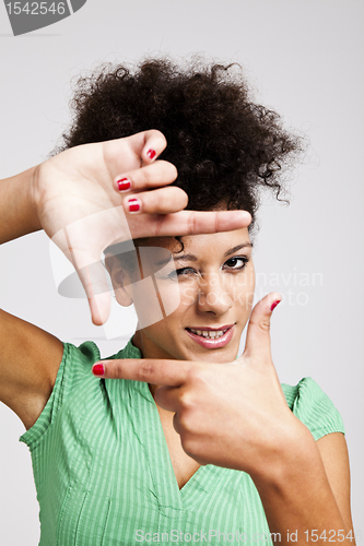 Image of Woman making a frame with fingers