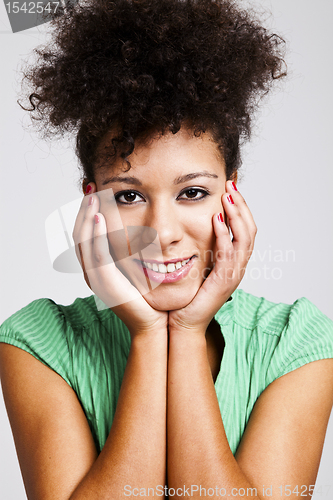 Image of Woman with hands on cheeks