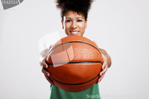 Image of Beautiful woman with basketball