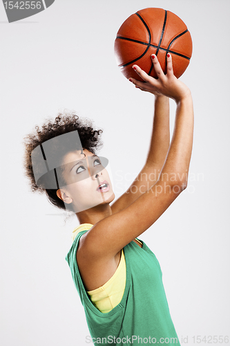 Image of Beautiful woman with basketball