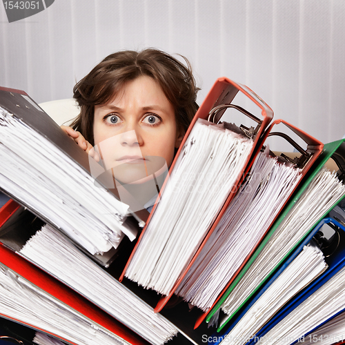 Image of Accountant swamped with financial documents