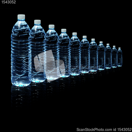 Image of Bottles of water isolated on black background