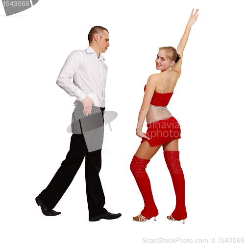 Image of Pair of young people perform ballroom dance