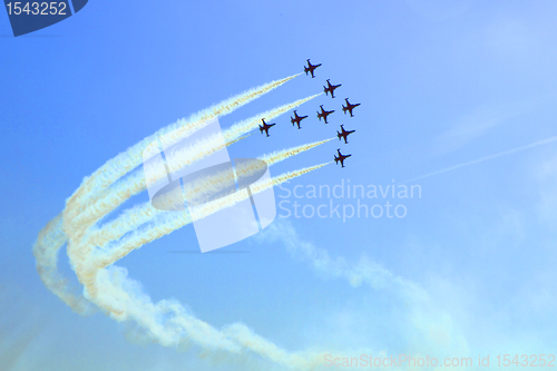 Image of arircraft show on the blue sky