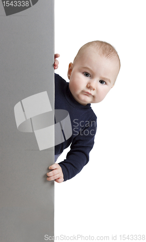 Image of young child holding vertical sign