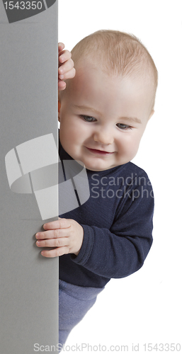 Image of young child holding vertical sign